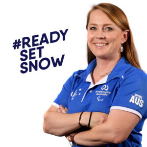 Image of Kate McLoughlin wearing a blue polo shirt with her arms folded across her chest. She is smiling at the camera. Text on the left of the image reads: Ready Set Snow.|Image of Kate McLoughlin wearing a blue polo shirt with her arms folded across her chest. She is smiling at the camera. Text on the left of the image reads: Ready Set Snow.|Image of Kate McLoughlin wearing a blue polo shirt with her arms folded across her chest. She is smiling at the camera. Text on the left of the image reads: Ready Set Snow.