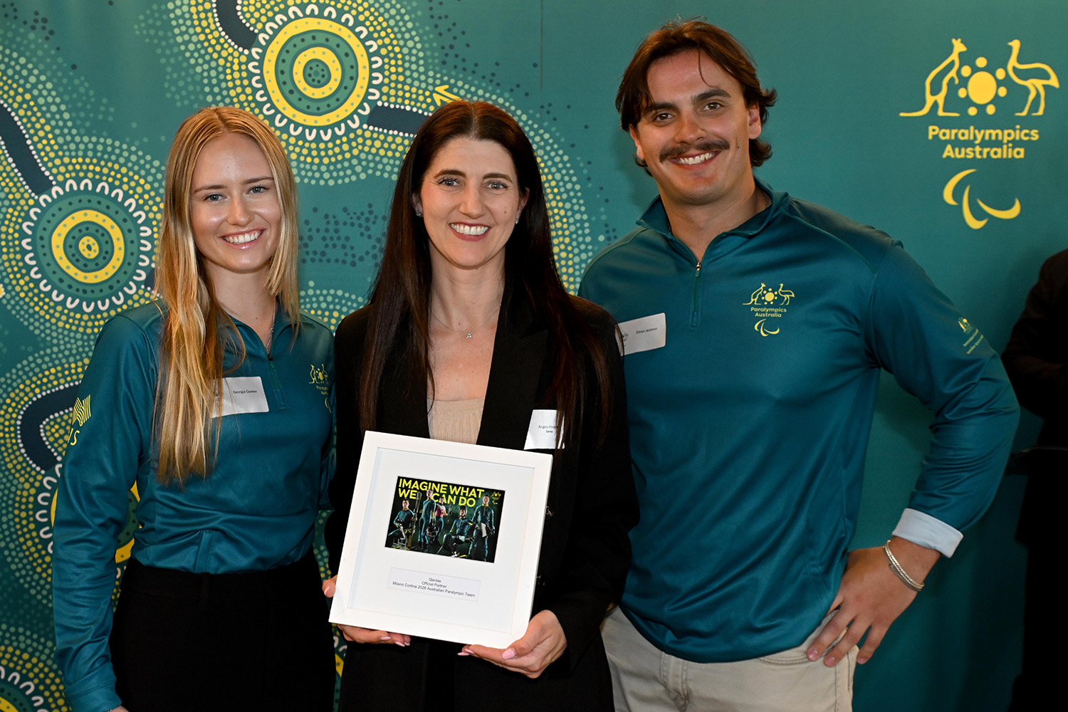 Group photograph of two Paralympians and a PA corporate partner