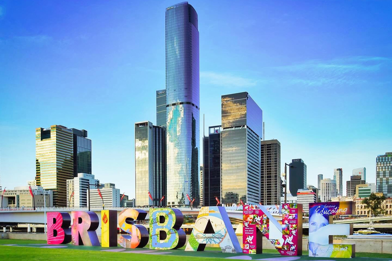 Image of Brisbane photographed from Southbank with the Brisbane sign in the foreground